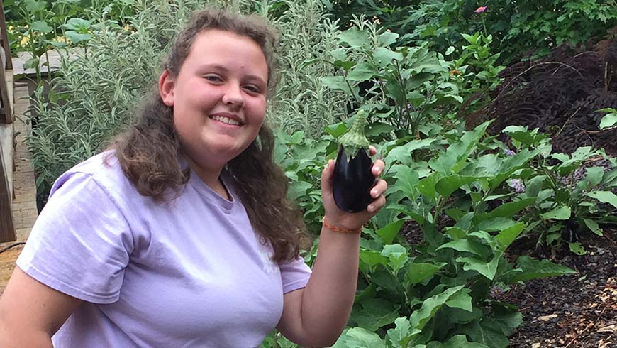 girl holding eggplant