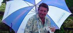 An umbrella was the accessory of the day. Jeff Glutz braves the rain during the Gala in the Garden.