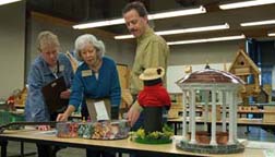 Beth Jimenez and Kathleen Thompson, and John Dole (left to right), News and Observer Birdhouse Competition