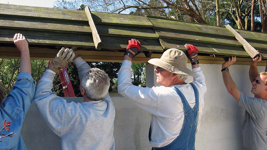 construction volunteers repairing Japanese Garden