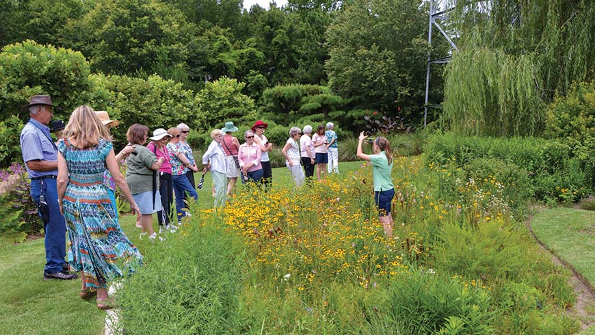 Rebecca Turk (on right) leading tour at Moore Farms Botanical Garden